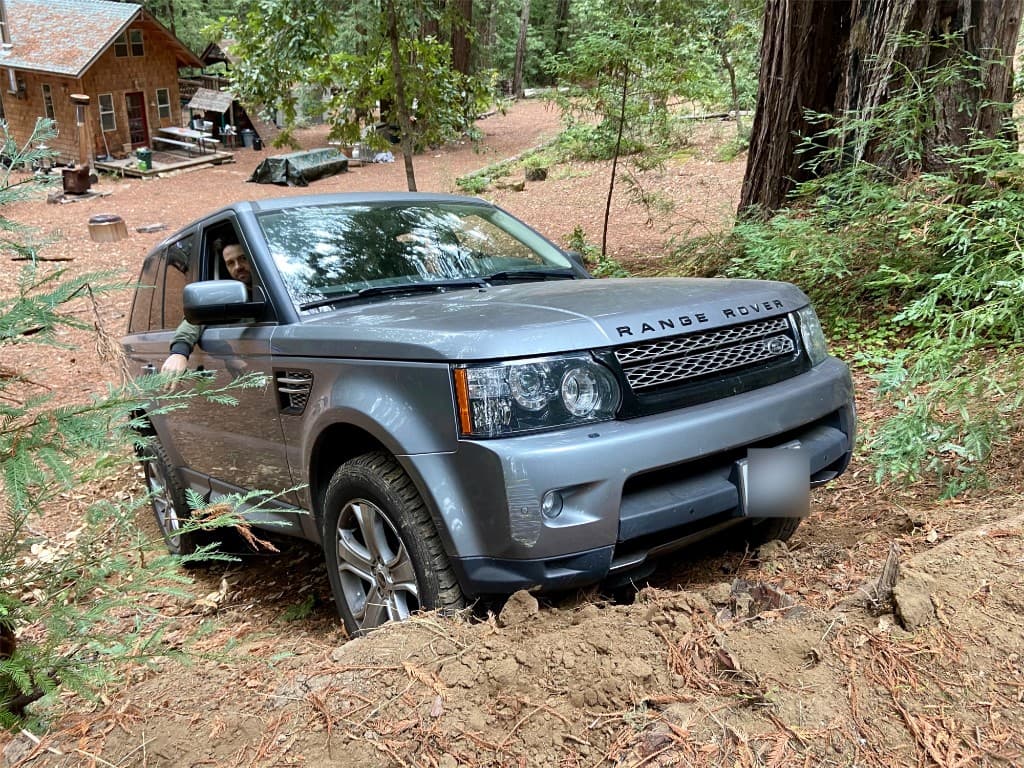 Range Rover Sport off-roading on a forest trail